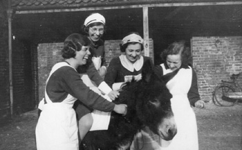 Kathleen and fellow housemaids on a donkey ride.